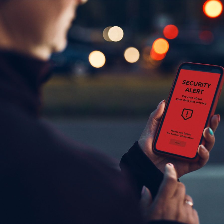 Security alert on smartphone screen. Antivirus warning. Private data protection system notification